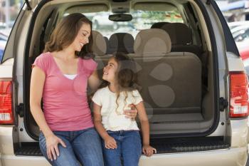 Royalty Free Photo of a Woman and Girl in a Hatchback