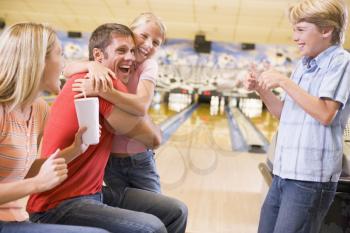 Royalty Free Photo of a Family Bowling