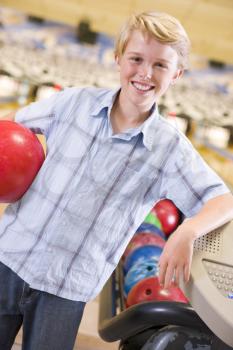 Royalty Free Photo of a Boy at a Bowling Alley