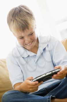 Royalty Free Photo of a Young Boy Playing Video Games