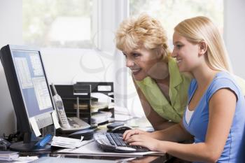 Royalty Free Photo of a Mother and Daughter at the Computer