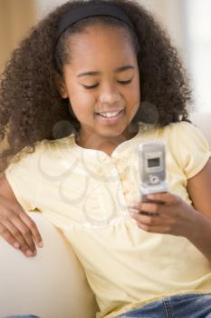 Royalty Free Photo of a Young Girl With a Cellphone