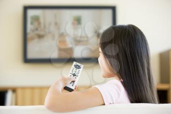 Royalty Free Photo of a Girl Watching Television