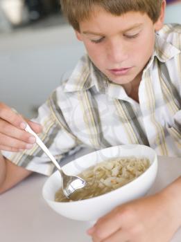 Royalty Free Photo of a Boy Eating Soup