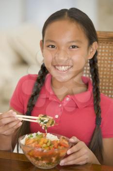 Royalty Free Photo of a Girl Eating Chinese