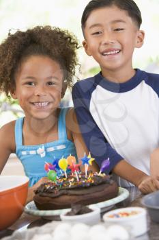 Royalty Free Photo of Two Children With a Birthday Cake