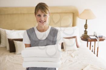 Royalty Free Photo of a Woman Holding Towels