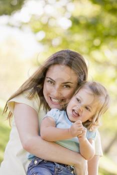 Royalty Free Photo of a Mother Holding a Daughter