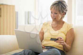 Royalty Free Photo of a Woman With a Laptop and Credit Card
