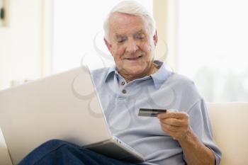 Royalty Free Photo of a Man With a Laptop and Credit Card