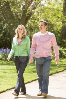 Royalty Free Photo of a Couple Holding Hands and Walking