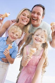 Royalty Free Photo of a Family at the Beach With Ice Cream