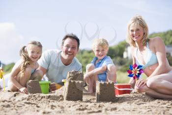 Royalty Free Photo of a Family Making Sand Castles