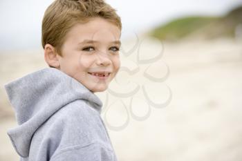 Royalty Free Photo of a Young Boy on the Beach