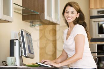 Royalty Free Photo of a Woman on the Computer at Home
