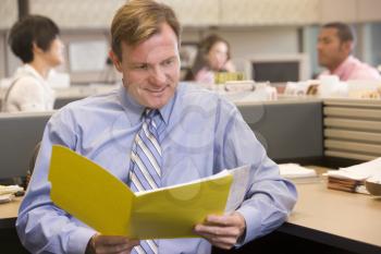 Royalty Free Photo of a Man Reading a File