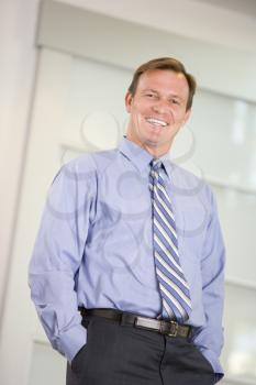 Royalty Free Photo of a Smiling Man in a Blue Shirt