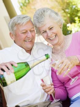 Royalty Free Photo of a Couple Having Champagne