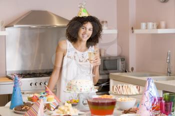 Royalty Free Photo of a Woman With Party Food and a Drink
