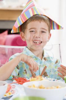 Royalty Free Photo of a Little Boy at a Birthday Party