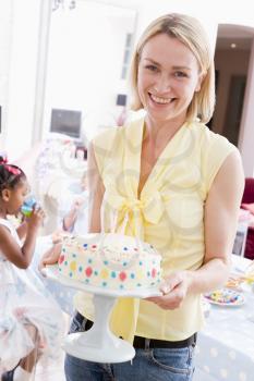 Royalty Free Photo of a Woman With a Birthday Cake