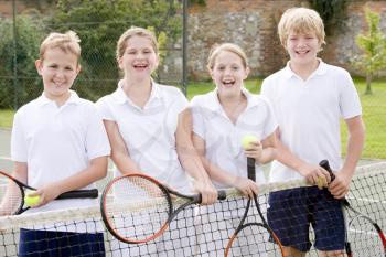 Royalty Free Photo of Kids on a Tennis Court