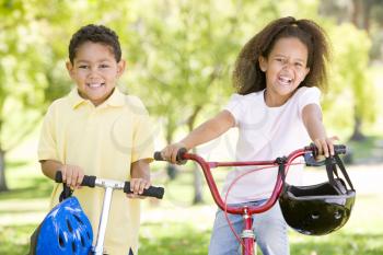 Royalty Free Photo of a Brother and Sister on Bikes