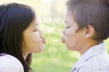 Royalty Free Photo of a Brother and Sister Making Faces