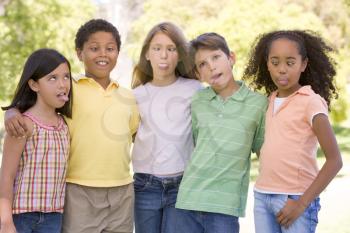 Royalty Free Photo of a Group of Five Children Making Faces