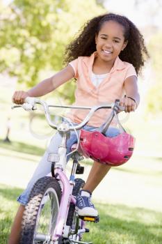 Royalty Free Photo of a Girl on a Bike