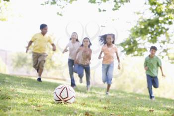 Royalty Free Photo of Children Playing Soccer