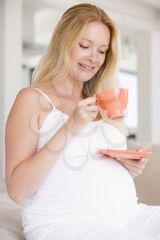 Royalty Free Photo of a Pregnant Woman Drinking Tea
