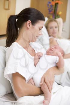 Royalty Free Photo of a Mom Withe a New Baby