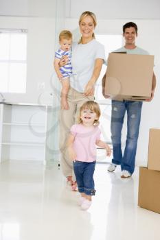 Royalty Free Photo of a Family Moving In To a New Home