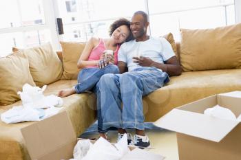 Royalty Free Photo of a Couple Relaxing on Moving Day