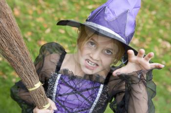 Royalty Free Photo of a Young Girl Dressed as a Witch