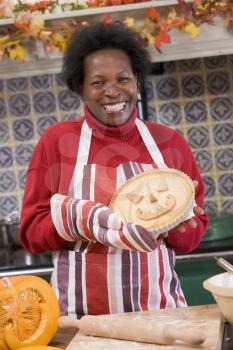 Royalty Free Photo of a Woman Making Halloween Pie