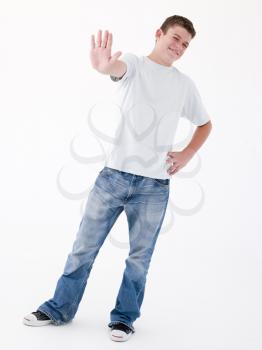 Royalty Free Photo of a Teenage Boy With His Palm Out