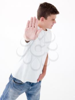 Royalty Free Photo of a Teenager With His Hand Up