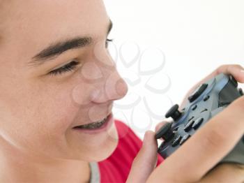 Royalty Free Photo of a Boy Using a Game Controller