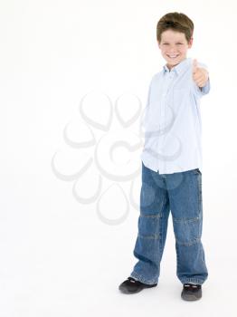 Royalty Free Photo of a Little Boy Giving a Thumbs Up