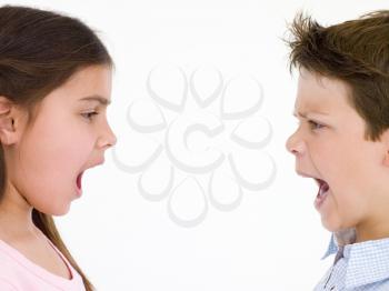 Royalty Free Photo of a Boy and Girl Shouting at Each Other