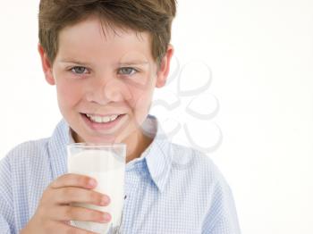 Royalty Free Photo of a Boy With a Glass of Milk