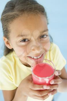 Royalty Free Photo of a Girl With a Glass of Juice