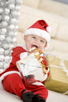 Royalty Free Photo of a Baby in a Santa Costume