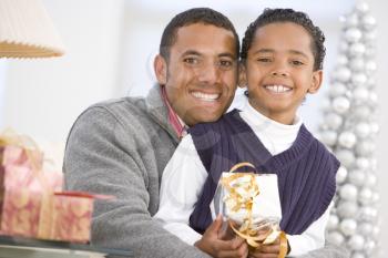 Royalty Free Photo of a Father and Son With a Gift
