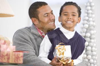 Royalty Free Photo of a Father and Son With Gifts