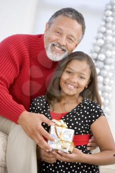 Royalty Free Photo of a Grandfather and Daughter With a Gift