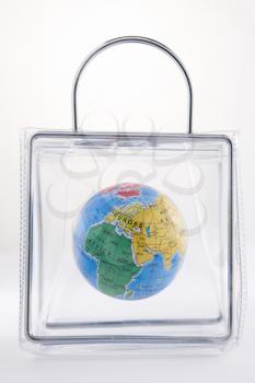 Royalty Free Photo of a Globe in a Plastic Bag
