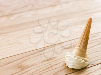 Royalty Free Photo of an Ice Cream Cone on the Floor